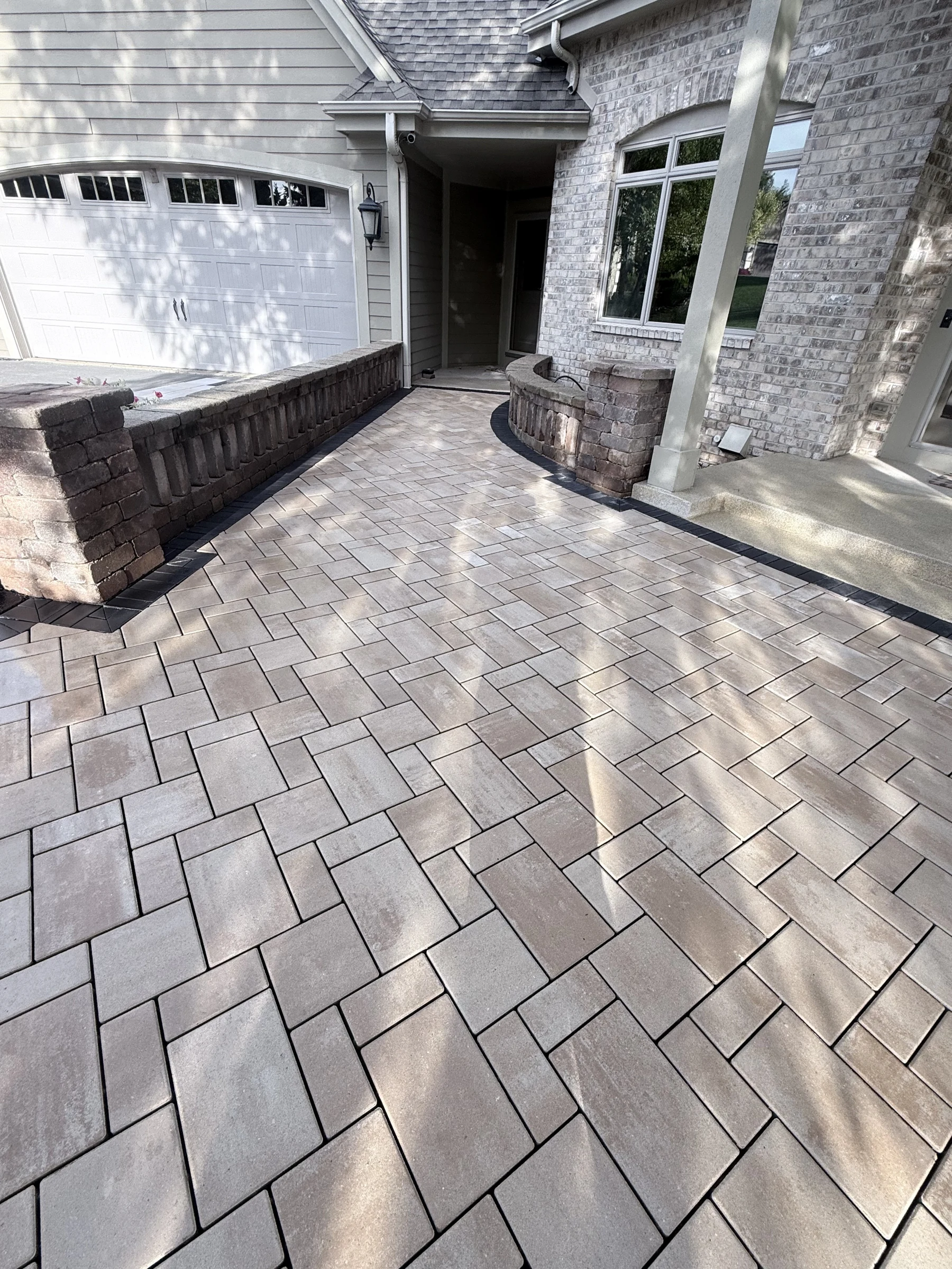 Temporary walkway service illustration showing a paver path between a driveway and entrance