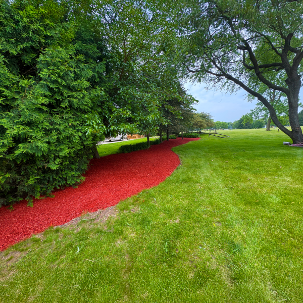 Decorative landscape bed installation around a Waukesha County home
